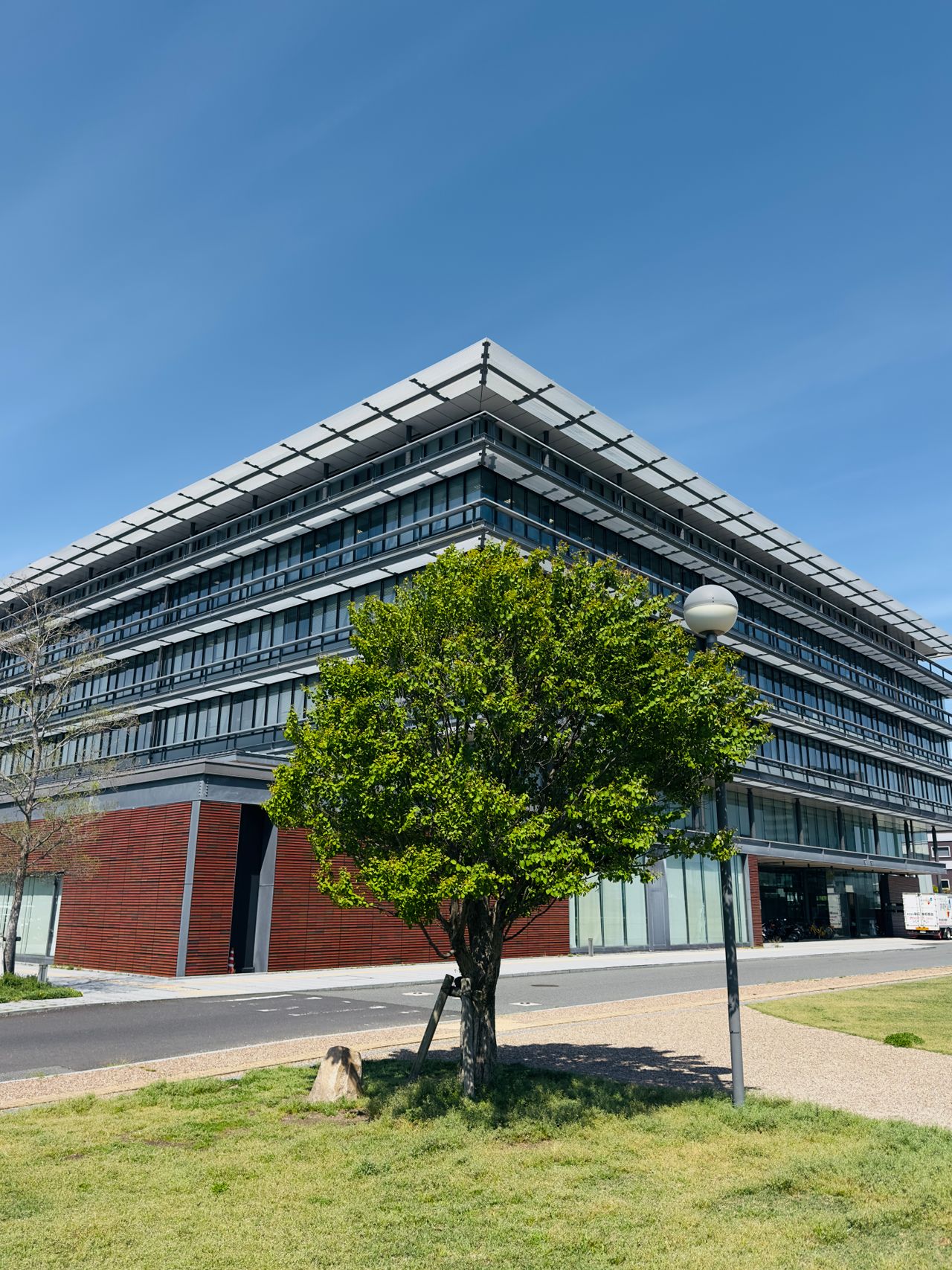 A contemporary business campus in daylight with landscaped surroundings